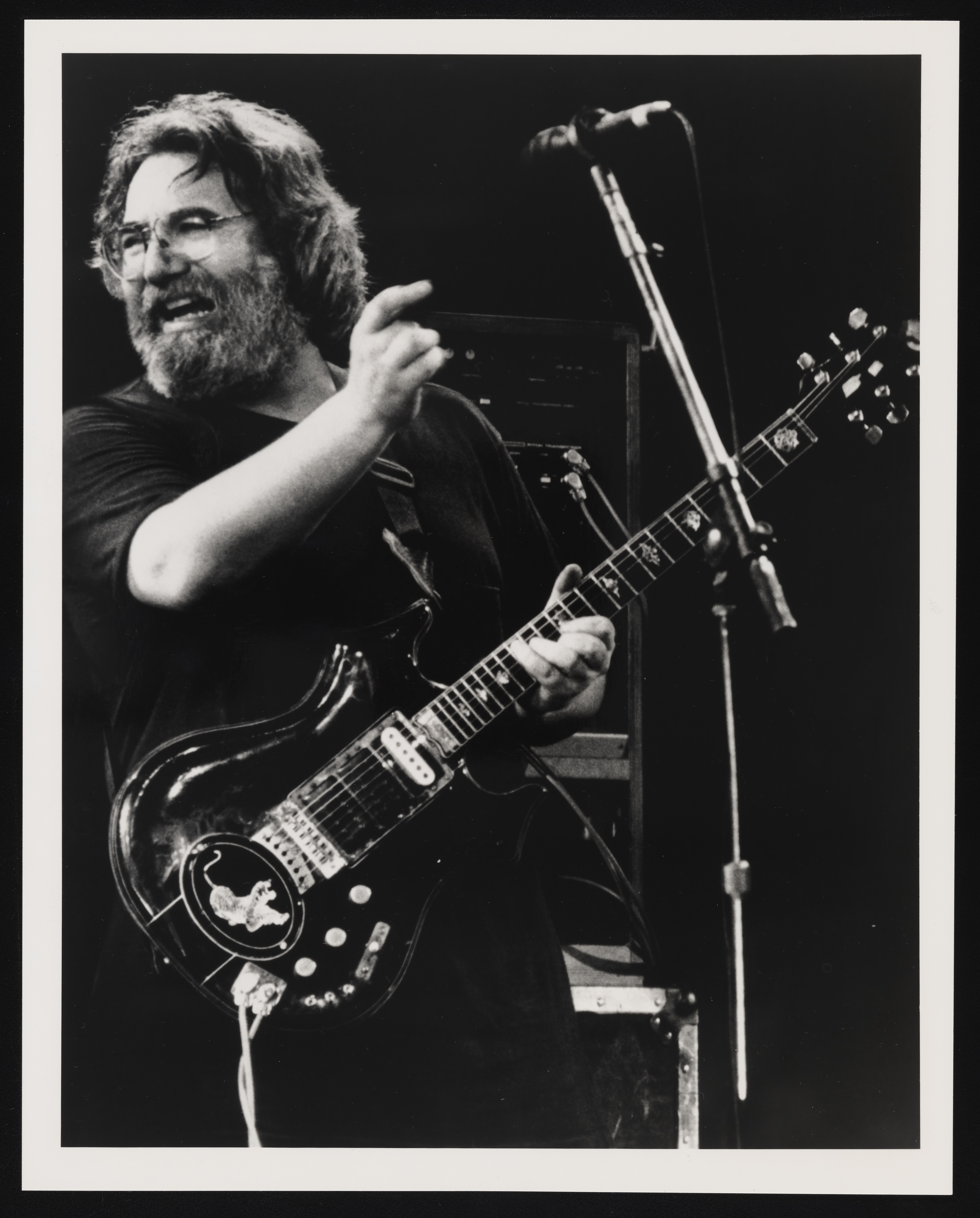 Grateful Dead guitarist Jerry Garcia ecstatically strums his guitar